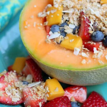 yogurt cantaloupe bowl filled with fruit and granola